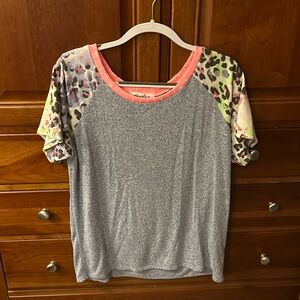 NWT awesome soft blue short sleeved top. Pink trim. Leopard sleeves.